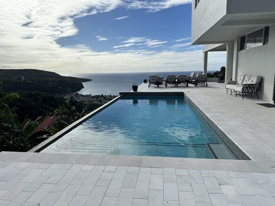Blue Waters Pool with Sea and Mountain View
