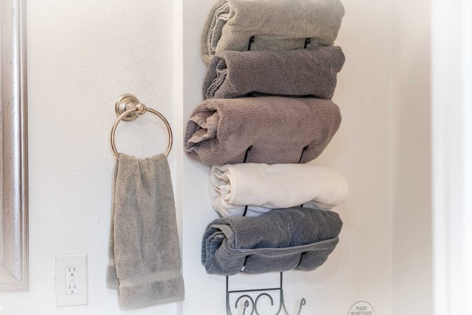 Fresh towels and toiletries are ready for you in this sparkling bathroom