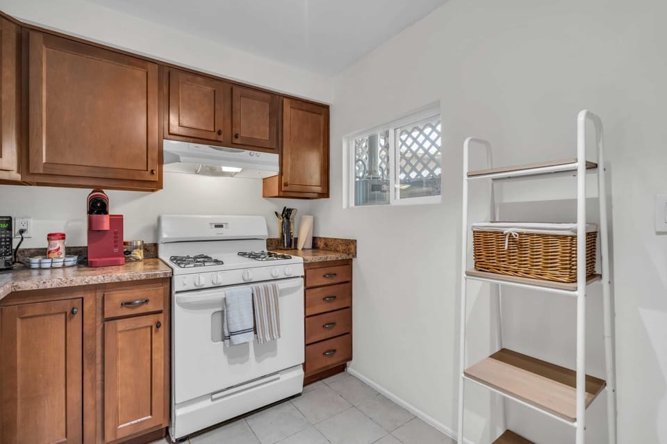 Fully stocked kitchen with modern appliances for a stress-free cooking experience.