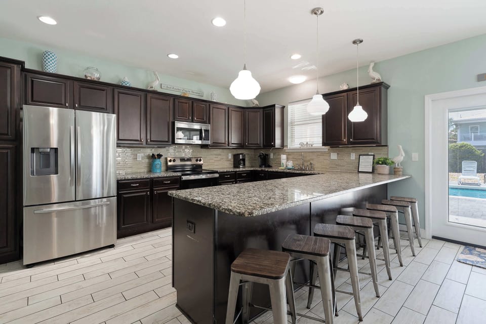 Enjoy gathering at the breakfast bar for a quick bite with seating for 8.