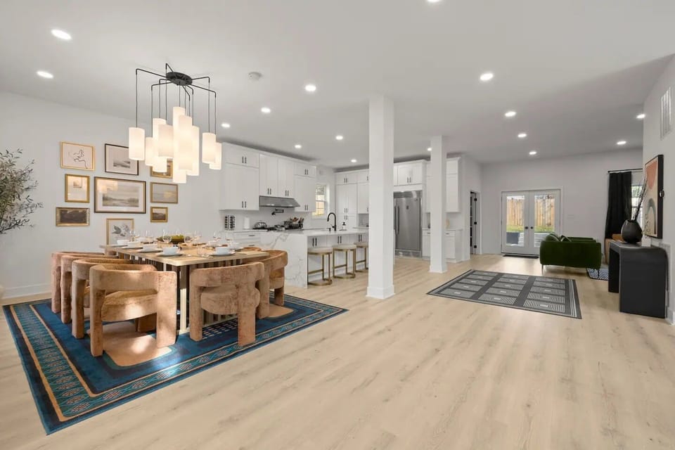 A stunning, modern dining area set for an elegant gathering.