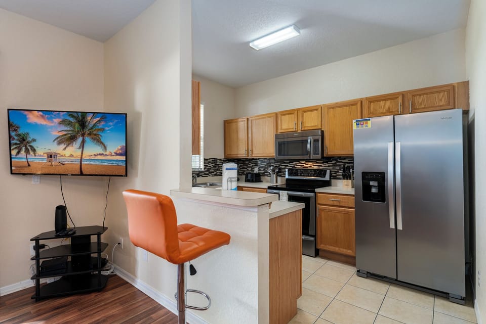 Kitchen view showing Breakfast Bar and TV
