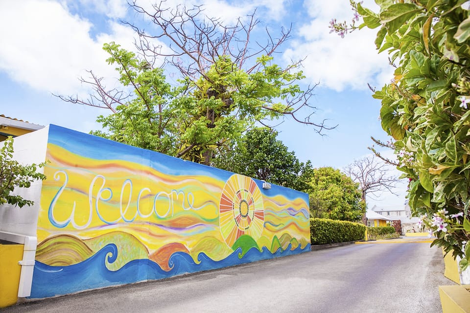 Arrive smiling to a colorful mural and easy driveway access