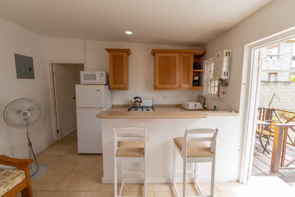 Start mornings with coffee beside the sunny breakfast bar.