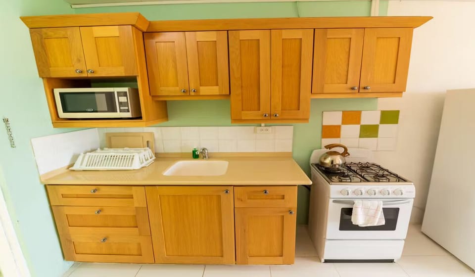Start mornings with coffee and breakfast in the compact kitchen.