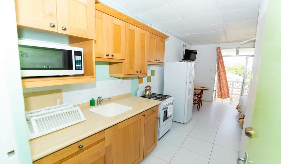 Prepare quick snacks in the sunny kitchenette with full-size fridge.