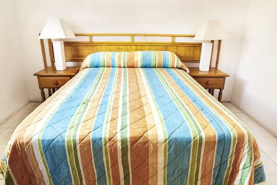 Drift off comfortably in a bright room with classic furnishings.
