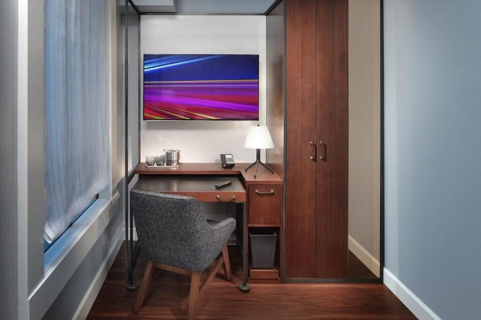 Catch up on work at a sleek desk with storage.