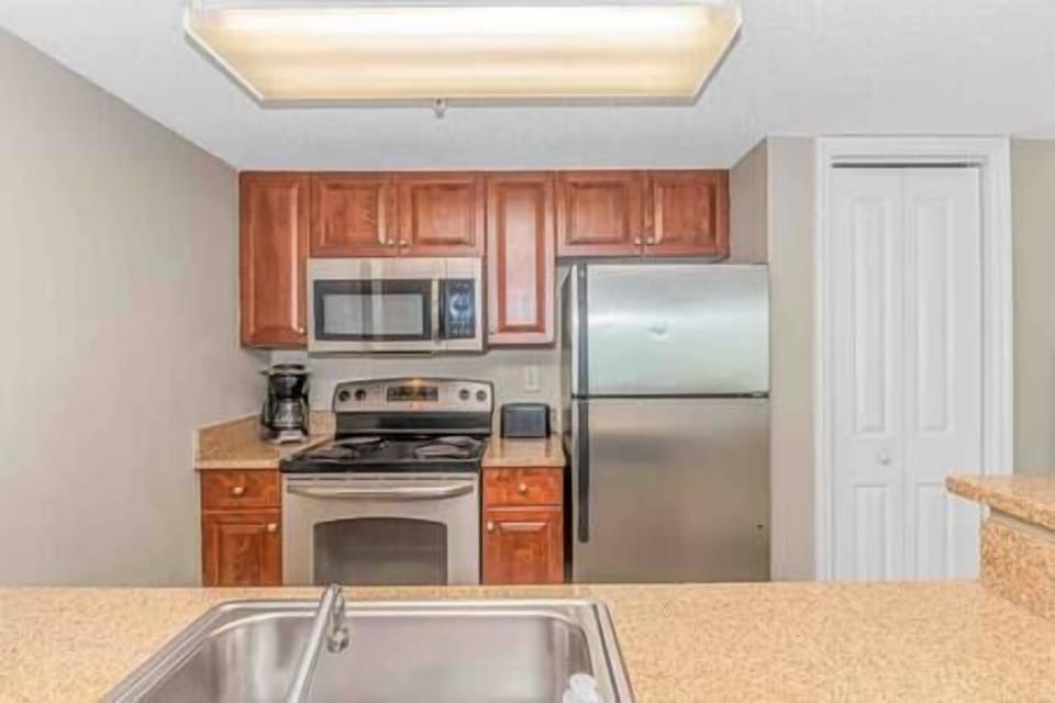 Plenty of counter-space and also features a pantry. Fully stocked with everything to cook meals!