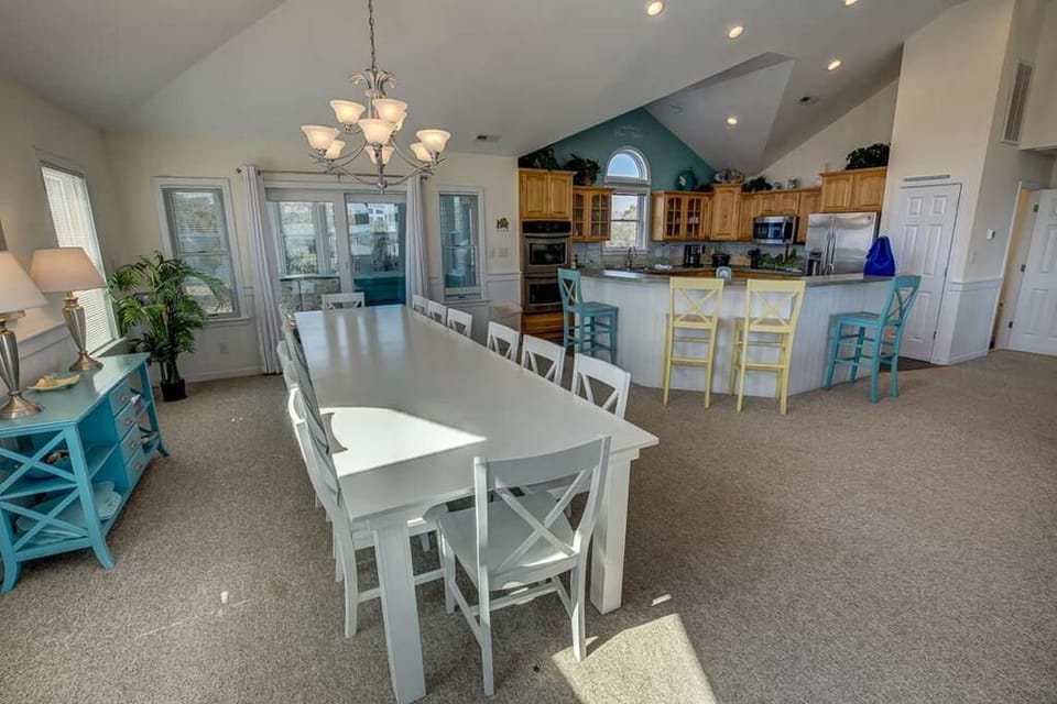 Dining Area with Kitchen in Background