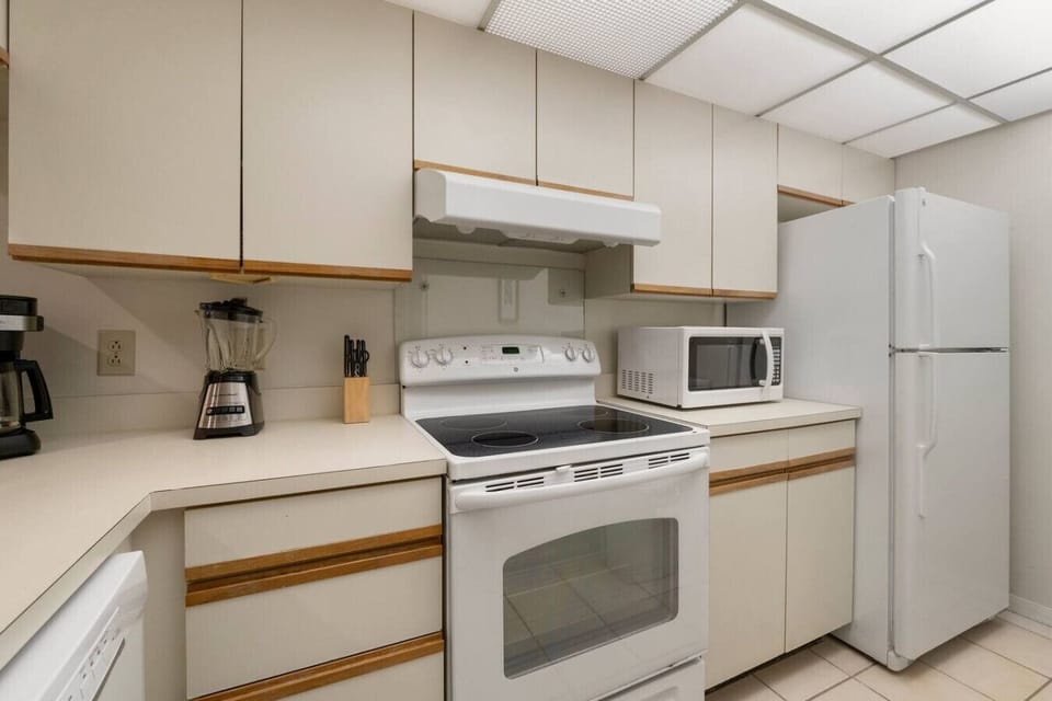 Fully Stocked Kitchen with Bar Seating