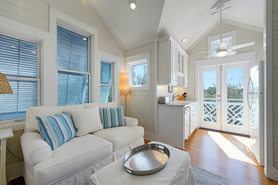 LIVING AREA ADJACENT TO KITCHEN AND BALCONY