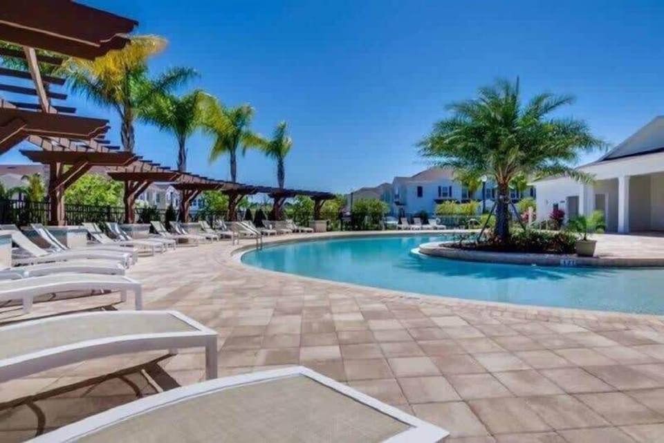 The community pool has plenty of lounging space.