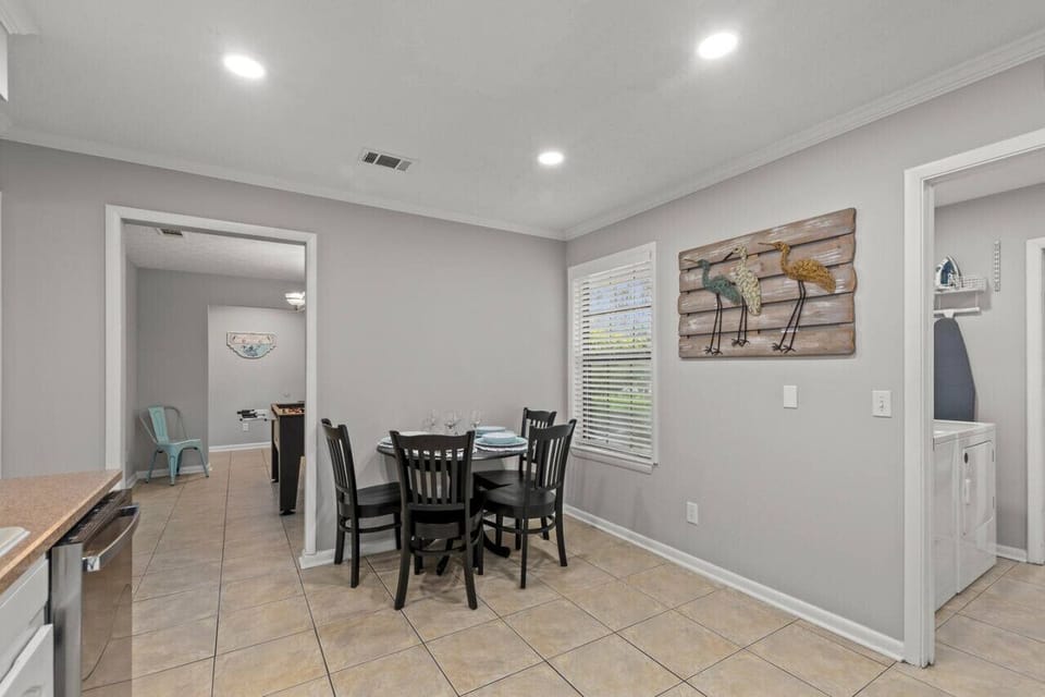 Step into our charming kitchen area, complete with a cozy breakfast table, where you can start your day with a delicious meal and a cup of coffee, surrounded by the warmth of home and the aroma of culinary delights