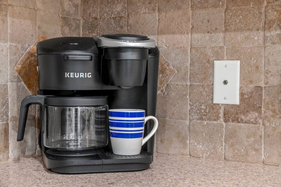 Indulge in your favorite brew with our Keurig coffee machine, perfect for starting your day with a freshly brewed cup of coffee or enjoying a cozy afternoon pick-me-up