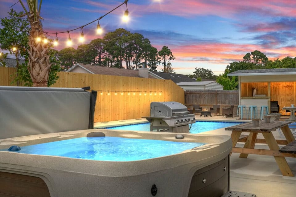 Evenings come alive with the hot tub and pool illuminated under the stars.