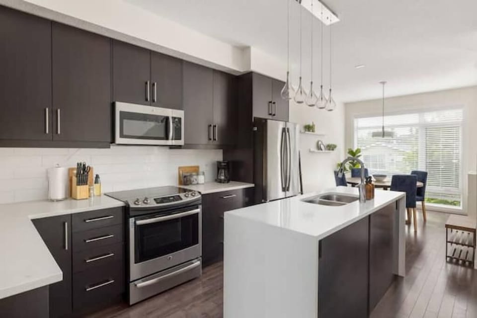 The kitchen opens up to the dining area that seats 4.