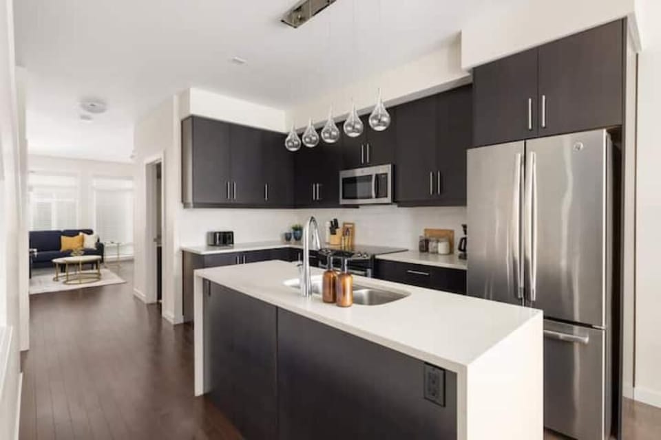The kitchen flows into the living room.