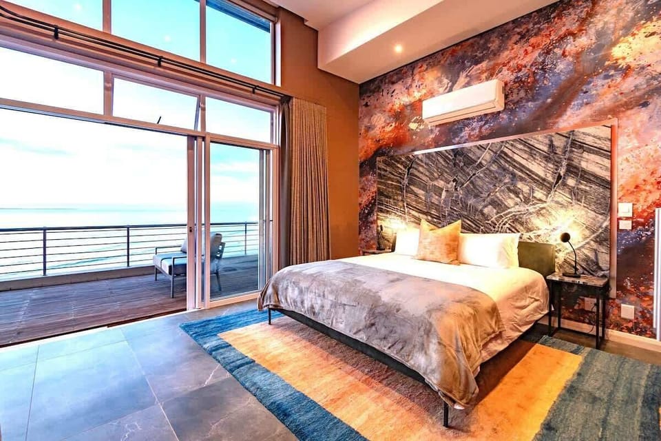 Double Volume master bedroom (ensuite) with extensive views of the sea. Imported Marble headboards... sleep like royalty.