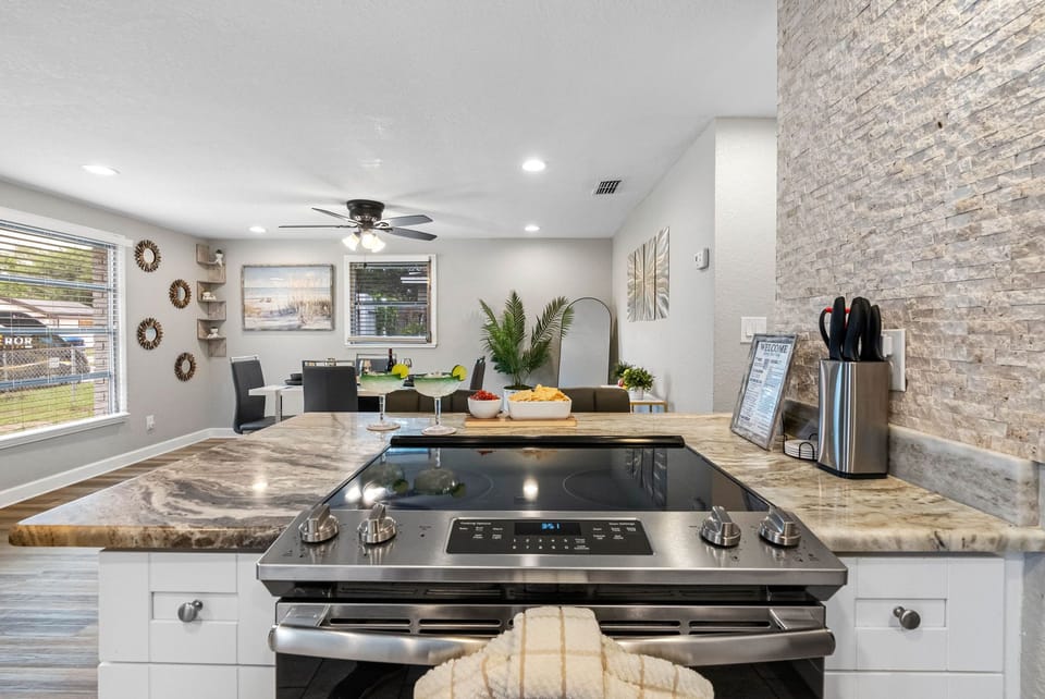 The kitchen features a sleek, contemporary design that is both visually appealing and highly functional.