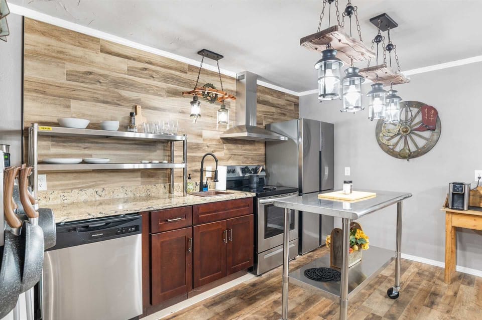 Brand-new appliances and plenty of cookware, dining ware, and utensils round out the well-appointed kitchen in the Rustic Suite!