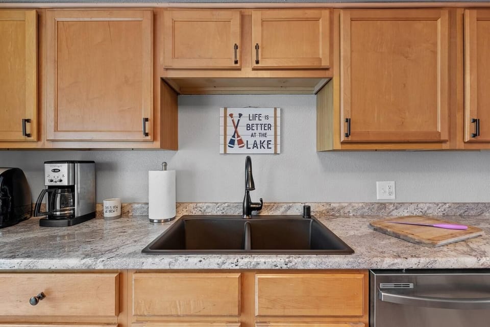 Clean, functional kitchen w/ a spacious sink and plenty of prep space.