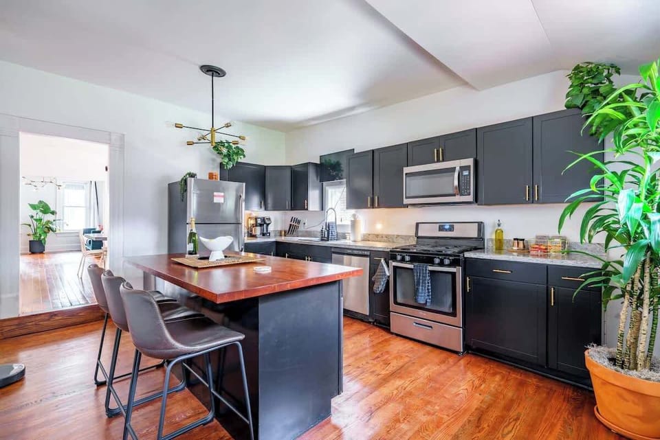 Enjoy a fully equipped kitchen with a Frigidaire stainless steel electric stove, single oven, and refrigerator. The space includes cooking basics, pots and pans, and all the dishes and silverware you need. A hot water kettle, coffee maker options, an