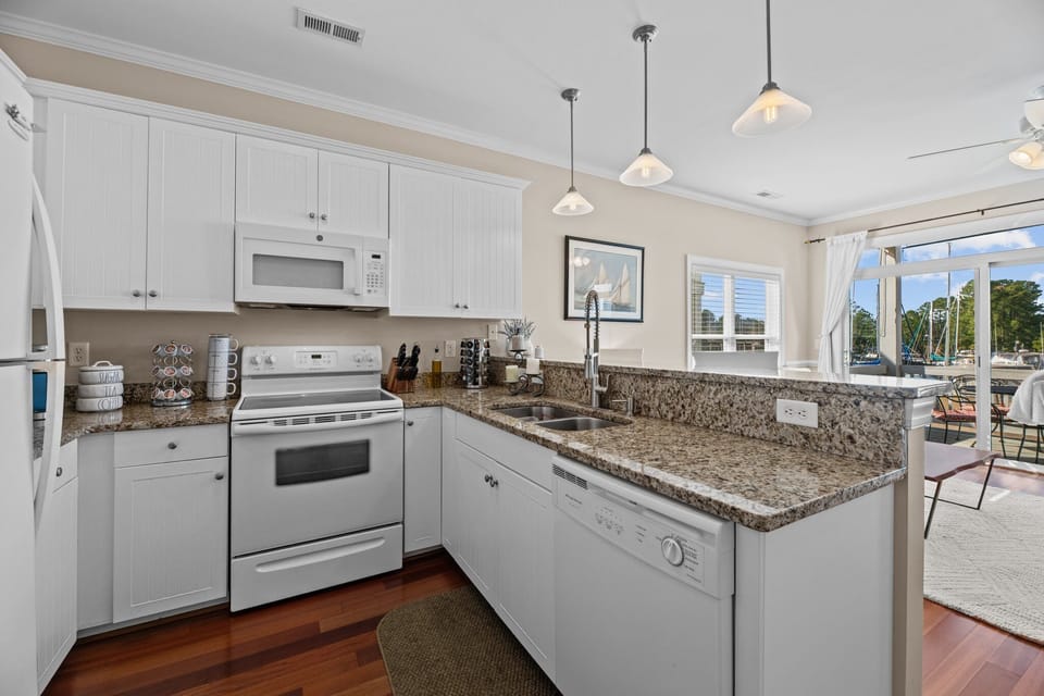 Culinary haven awaits! Step into this fully stocked kitchen,