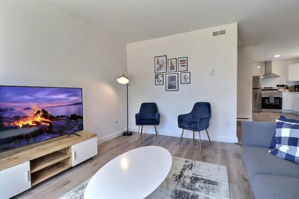 Cozy up in our spacious living room in front of the 55" Smart TV.