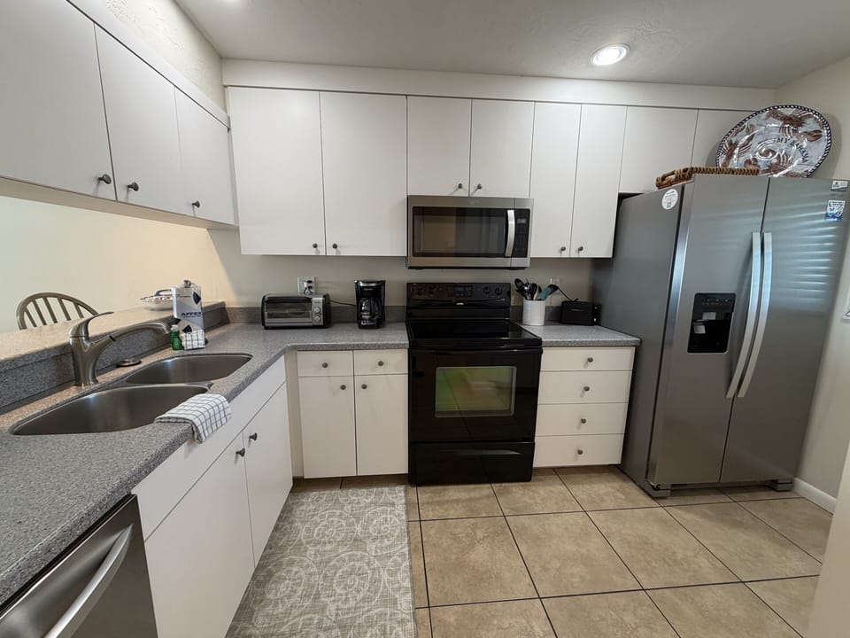 Your fully equipped kitchen features modern appliances and ample counter space for preparing delicious meals during your stay.