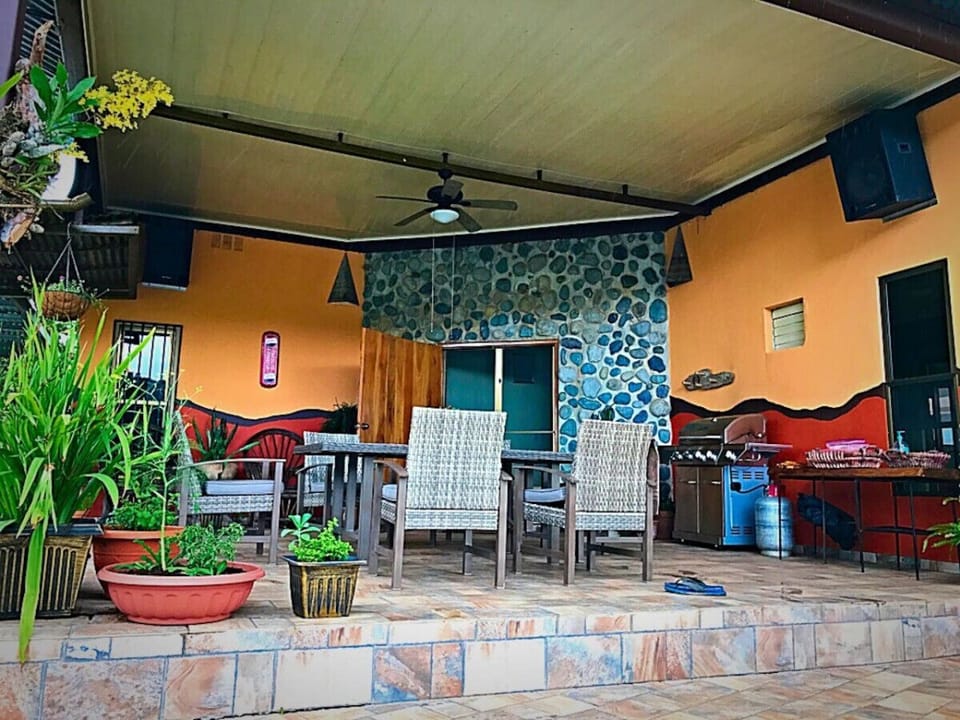 Covered Patio with grill and outdoor seating.