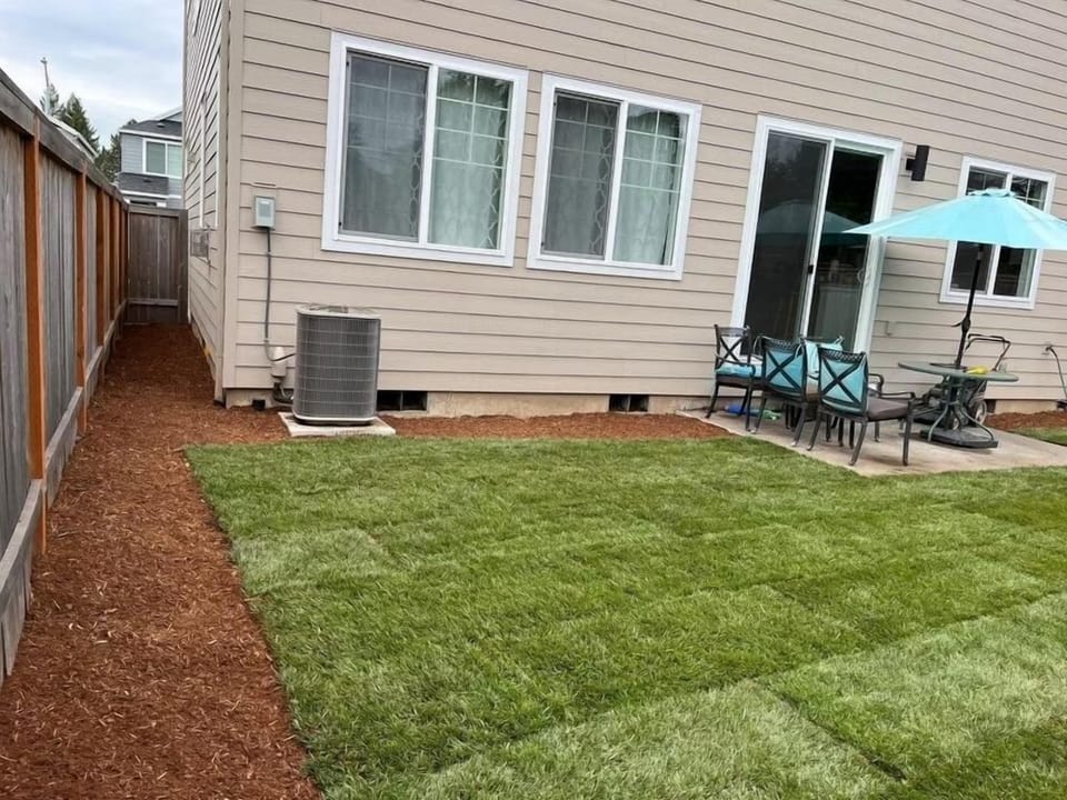 Landscaped backyard, great for breakfast, coffee or just relaxing with a book.