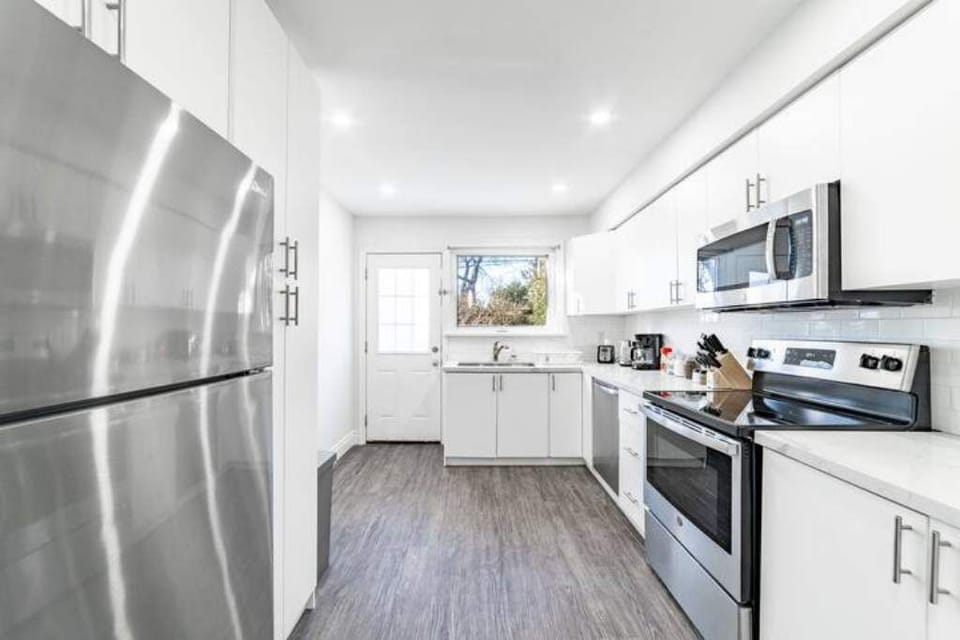 Brand new stainless steel appliances throughout the kitchen.