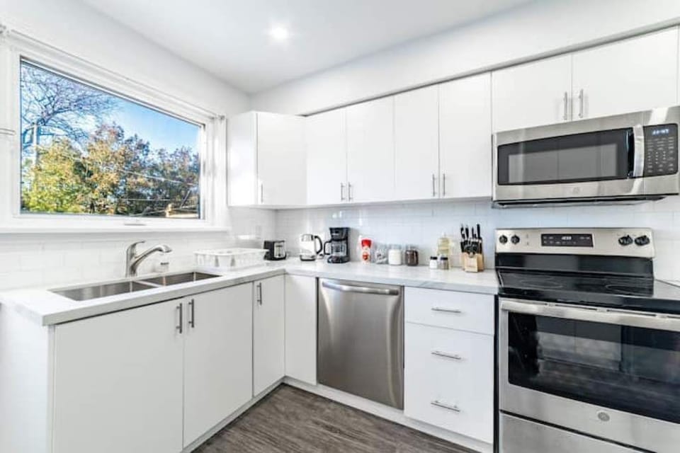 The window above the sink brings lots of natural light & overlooks the backyard