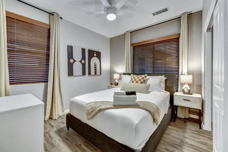 Third bedroom with a queen size bed and smart television.