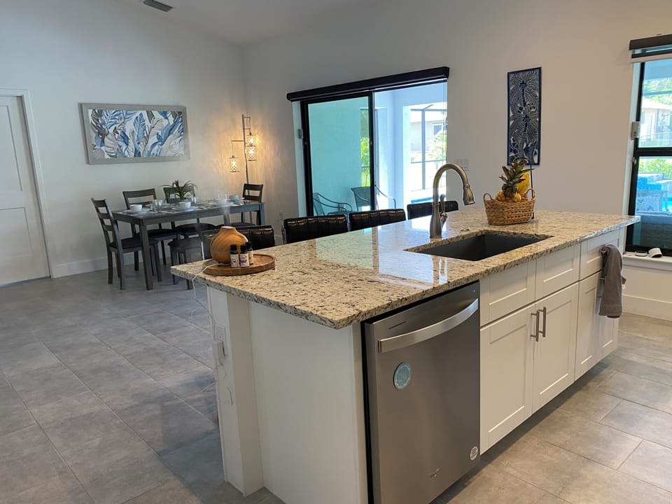 Large well-stocked kitchen with new appliances
