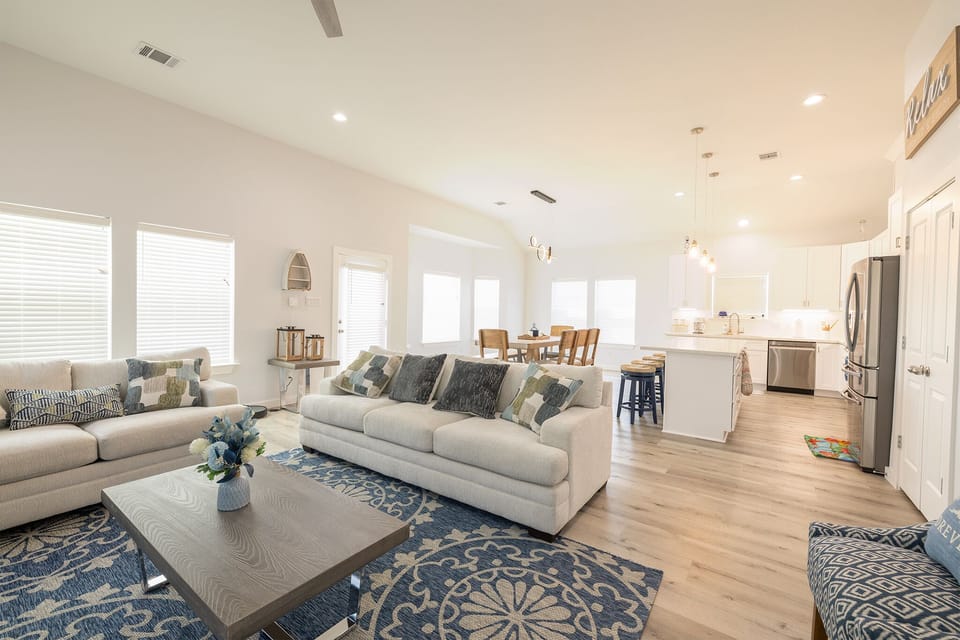 📖 Curl up with a good book on our inviting living room couches. 📚🛋️