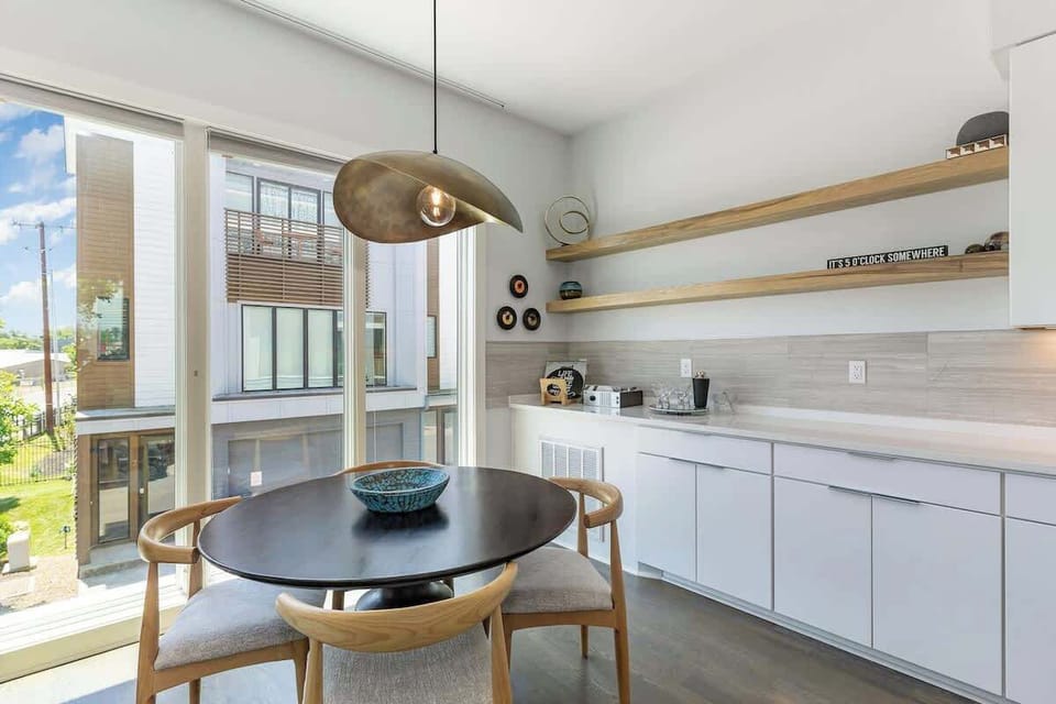 Designer furnishings surround the dining table for 4. (2nd Floor)