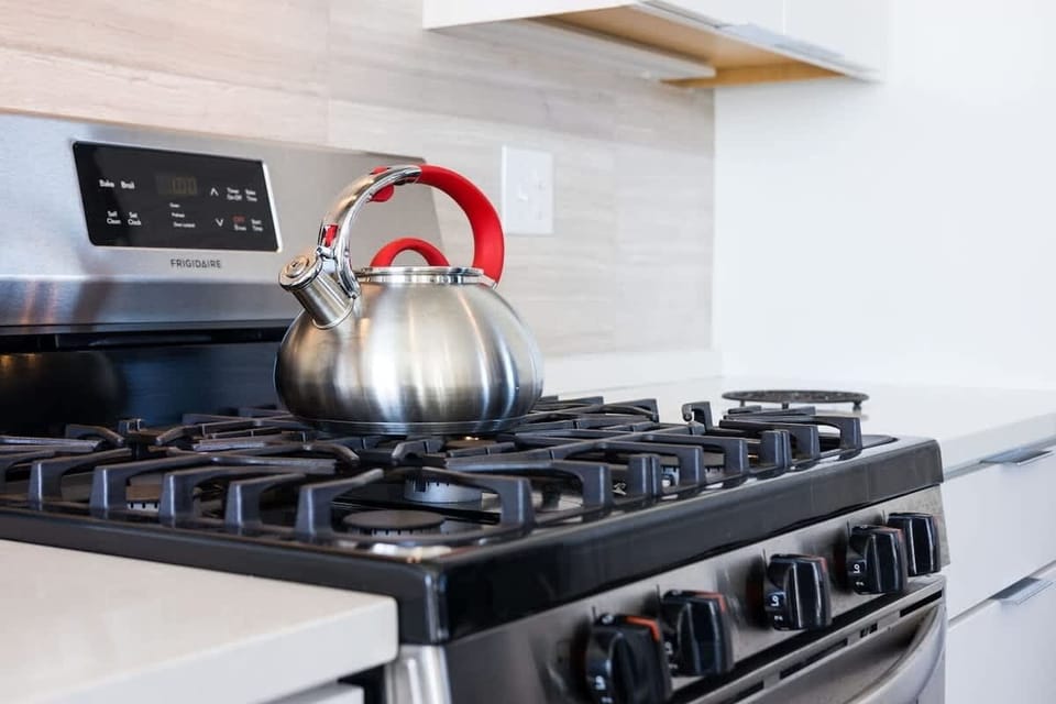 Fully equipped kitchen stocked with your basic cooking essentials, stainless-steel appliances, and breakfast bar seating. (2nd Floor)