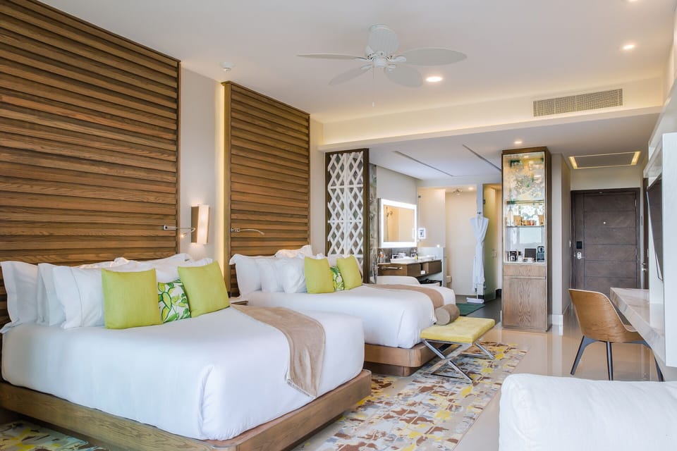 Garza Blanca Cancun: spacious suite with two beds, modern decor, and luxury bath