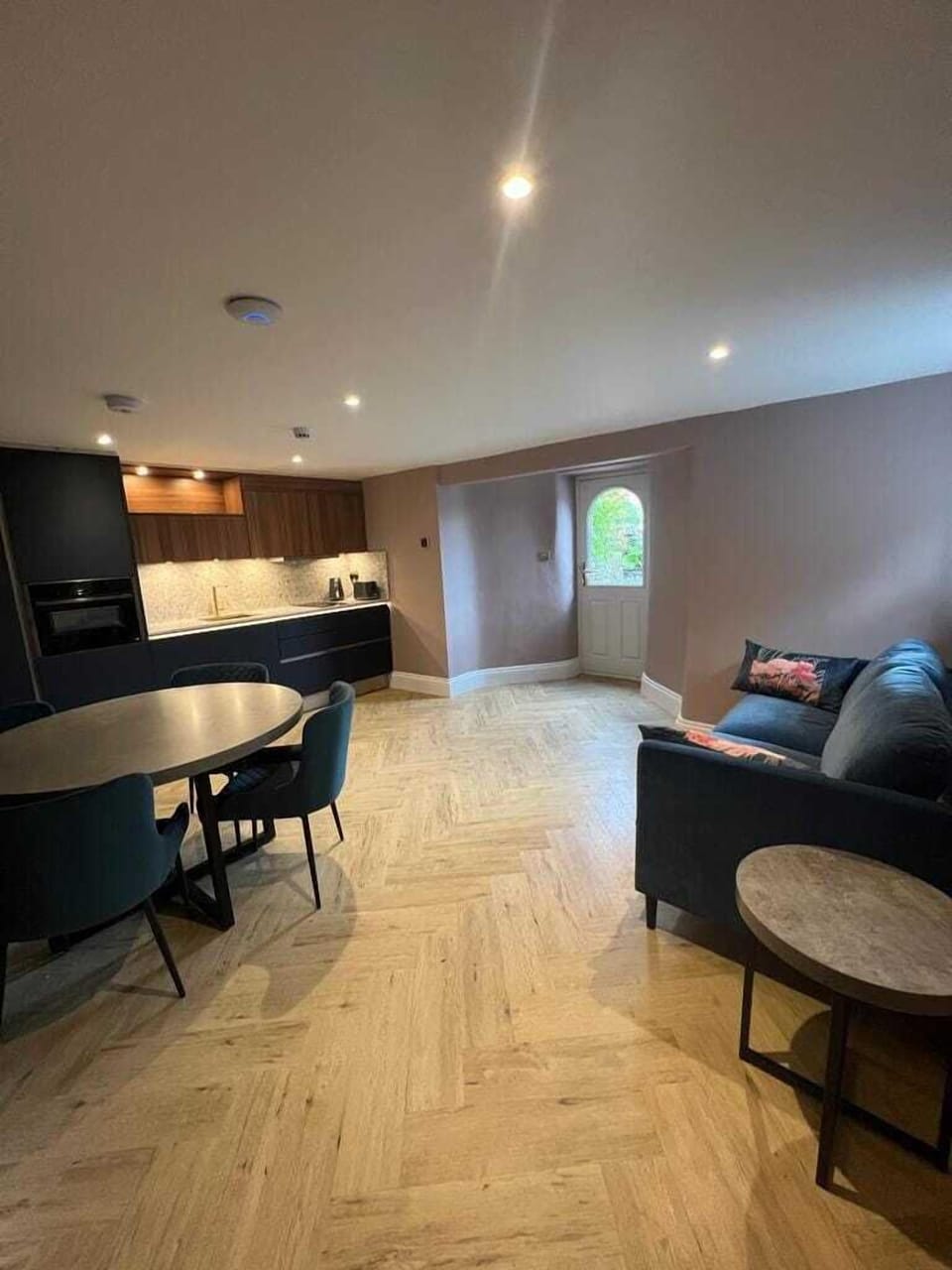 Unwind in the spacious living room and diner of the Wordsworth Apartment, featuring a full kitchen with Neff appliances, allowing you to relax and feel at home with the luxury and convenience of top-tier amenities.