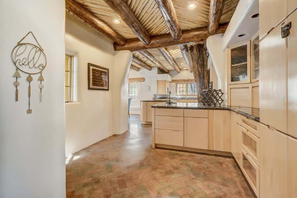 Our kitchen boasts enough cabinetry to hide all your secret snack stashes, and a granite countertop that's begging for some serious cooking action.