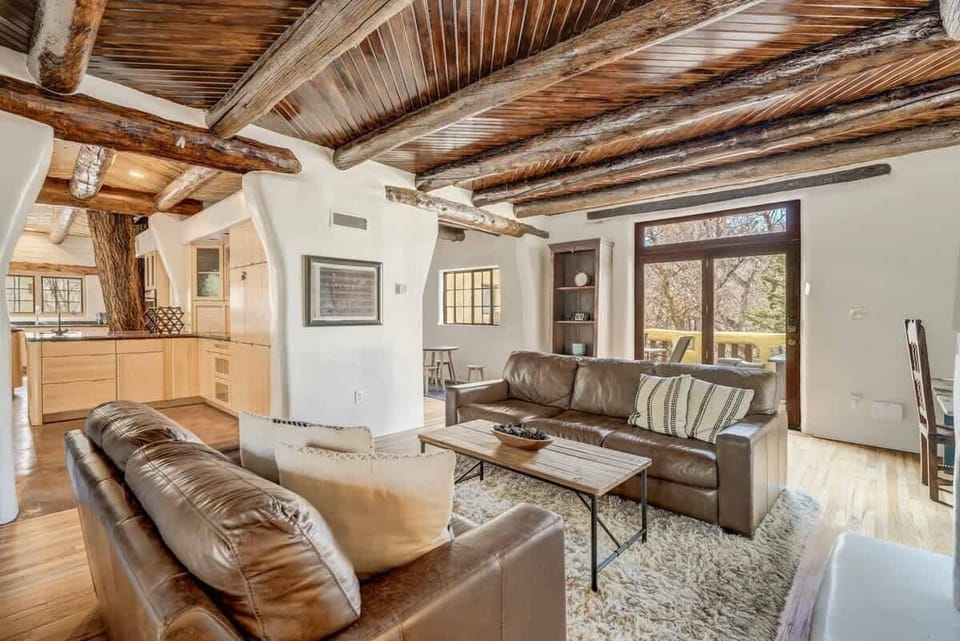 Take a peek into our kitchen, where even the live tree trunk seems to be enjoying the view of our cozy living room—just don't ask it for decorating tips!