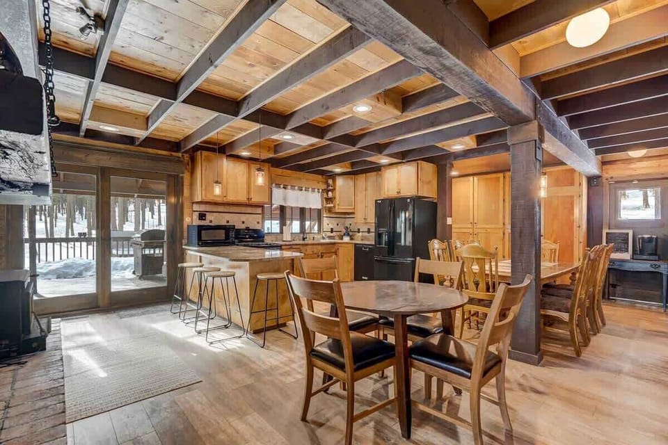 Welcome to the heart of the home, where culinary adventures await! With a kitchen stocked to the brim and a door beckoning to the BBQ and pines outside, it's like having your own gourmet getaway!