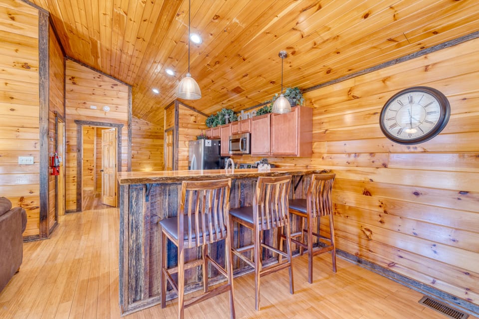 Kitchen features barstool seating.