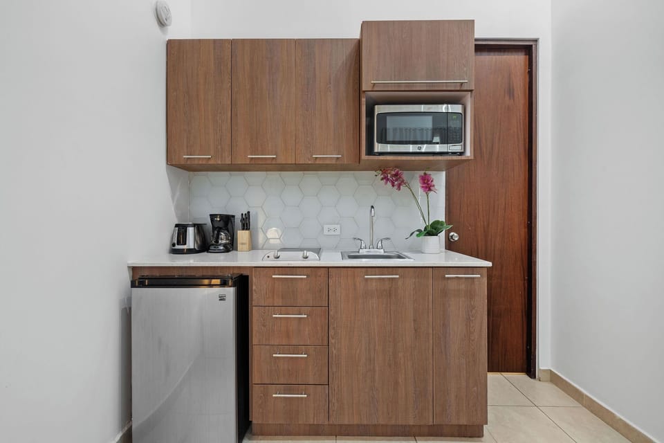 Prepare your favorite meals in the convenient kitchenette, equipped with a mini fridge, microwave, and two-burner stove.