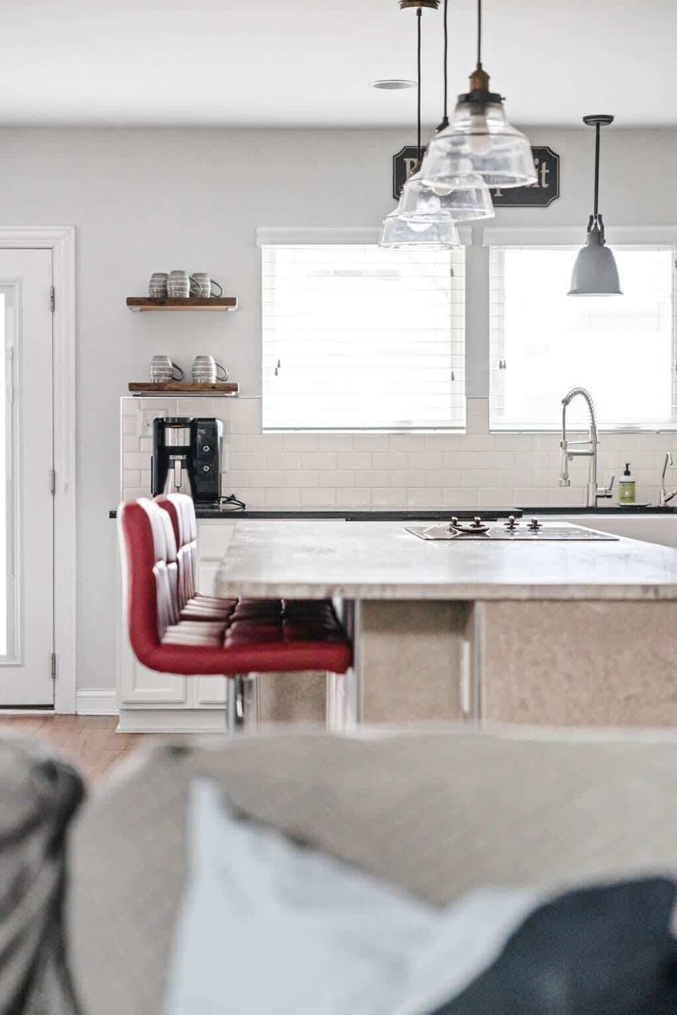 Our countertop boasts stylish seating arrangements and complementing lights above, creating a chic and inviting ambiance for your dining experience.