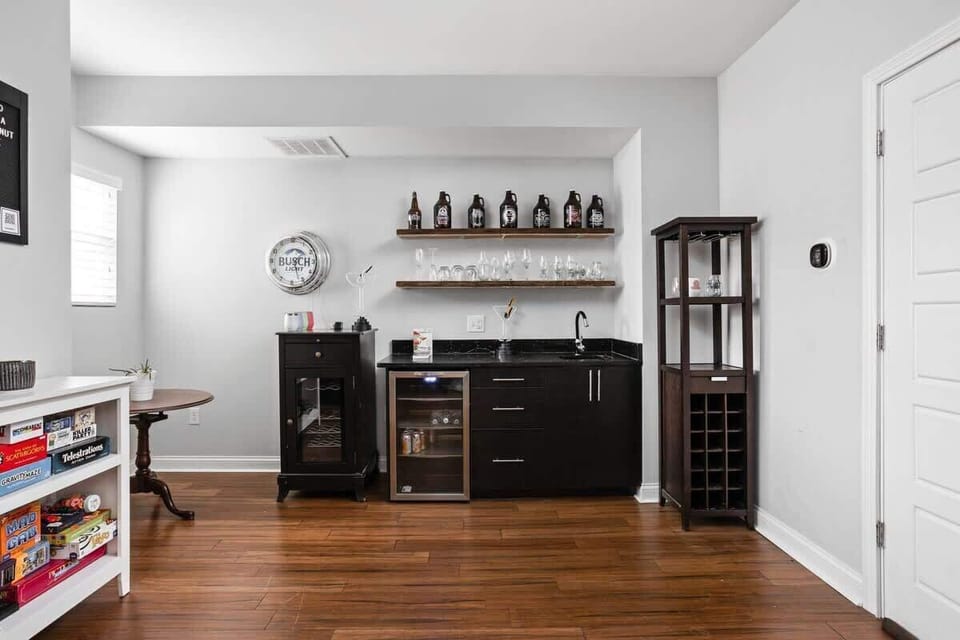 Our sink, cabinets, dresser, and unique collection of wine glasses combine functionality with charm, creating a delightful ambiance in the space.