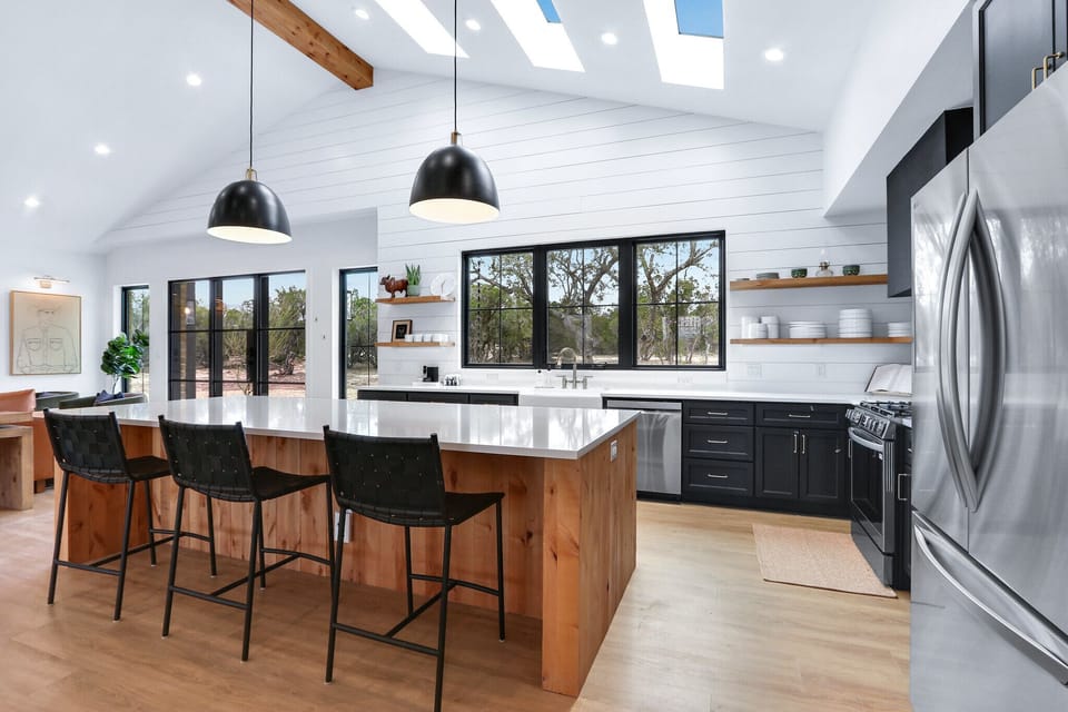 The kitchen is located behind the living room