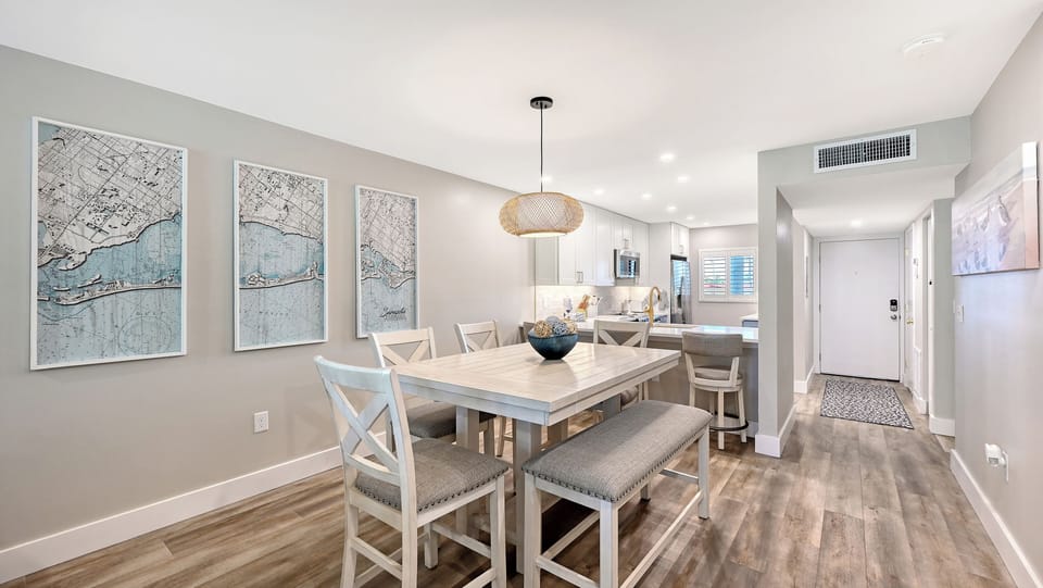 Step into your modern coastal retreat where family dinners flow seamlessly from dining to kitchen. Natural light brightens every corner, showcasing elegant finishes and thoughtful touches designed for your comfort.